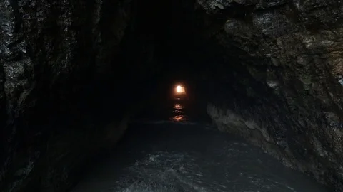 Tides rush in from ocean in cave  in costa rica Stock Footage 113169019