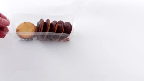 Tidy Cookie Row in Plastic Case- Bright, Clean Food Setup Stock-Footage 319004108