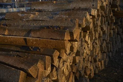 Tidy Stack of Concrete Railway Sleepers in Sunset Light Stock Photos