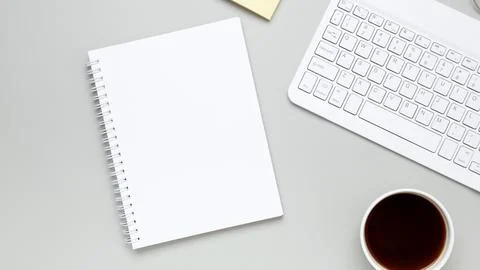 Tidy workspace featuring a coffee cup, glasses, and notebook, evoking a calm  Stock Photos