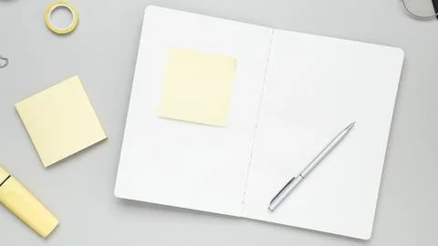 Tidy workspace featuring notebook, glasses, and stationery fostering producti Stock Photos