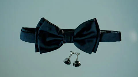 The tie and cufflinks are on the table Stock Footage 67657138