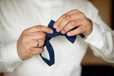 Tie a butterfly on a man Stock Photos
