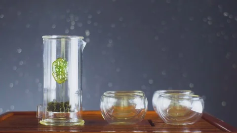 Tie Guan Yin. Chinese tea ceremony. Tea Tie Guan Yin is poured into the bowls. A Stock-Footage 89117953