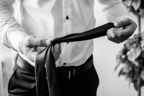 Tie in the hands Stock Photos