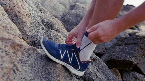 Tie shoes before a workout. slow motion, 1920x1080, full hd Stock Footage 90608281