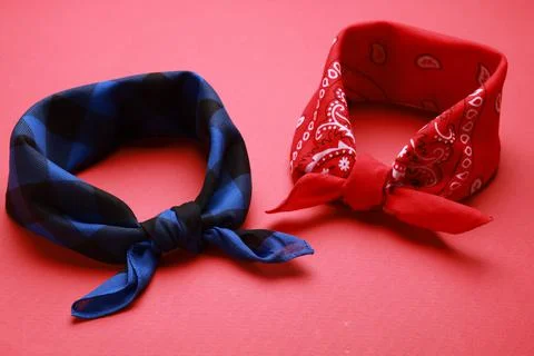 Tied bandanas with different patterns on red background Stock Photos