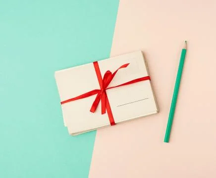 Tied red silk ribbon rectangular vintage greeting card 写真素材