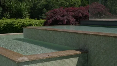 Tiered Infinity Pool With Water Cascading Between Levels Stock Footage 340182947