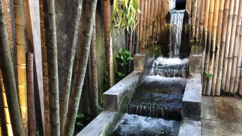 Tiered Stone Waterfall Feature in Bamboo Garden Video stock 343588491