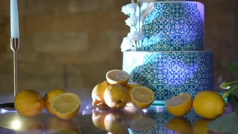 Tiered wedding cake with azulejo tile pattern and lemons Stock Footage 346093584