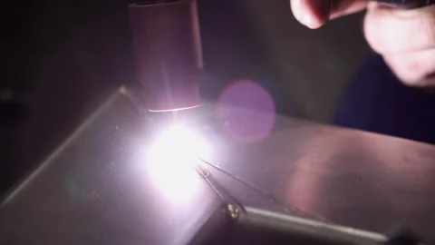TIG welder electrode glows white hot while welding a bead on aluminum Stock Footage 306953929