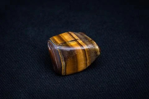 Tiger eye gemstone beautiful gemstone shining yellow and brown Stock Photos
