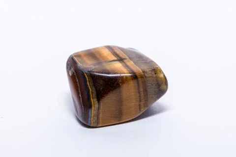 Tiger eye gemstone beautiful gemstone shining yellow gold brown isolated Stock Photos