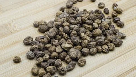Tiger Nuts Displayed On Wood Surface Stock Photos