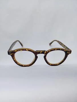 Tiger pattern eyeglass on a white background. Stock Photos