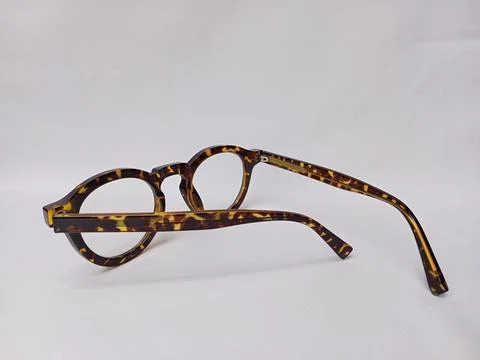 Tiger pattern eyeglass on a white background. Stock Photos