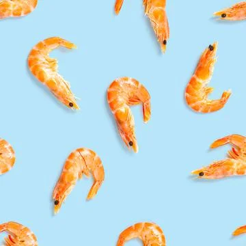 Tiger shrimp. Seamless pattern made from Prawn isolated on a blue background Stock Photos