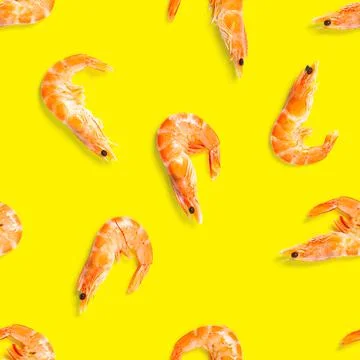Tiger shrimp. Seamless pattern made from Prawn isolated on a yellow background Stock Photos