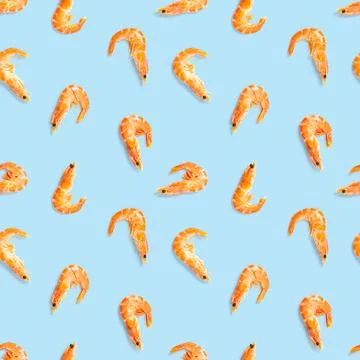 Tiger shrimp. Seamless pattern made from Prawn isolated on a blue background Stock Photos