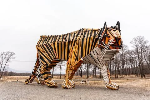 Tiger statue in the forest, copy of specification. Tiger made of wood Stock Photos