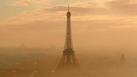 Tight aerial shot of the Eiffel tower in the morning fog Stock Footage 291623902