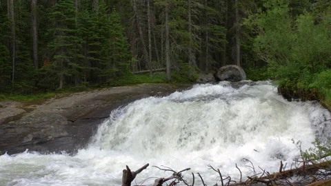 Tight angle small mountain waterfall rocky mountain national park 4k 60fps  Stock Footage 135326580