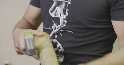 Tight blue flame on bracelet maker on table. Stock Footage 141361435