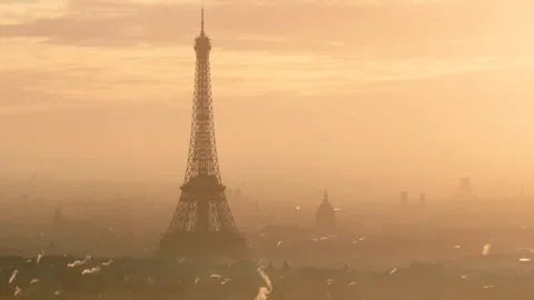 Tight circling shot of the Eiffel tower and Hôtel des Invalides at sunrise Stock Footage 290826056