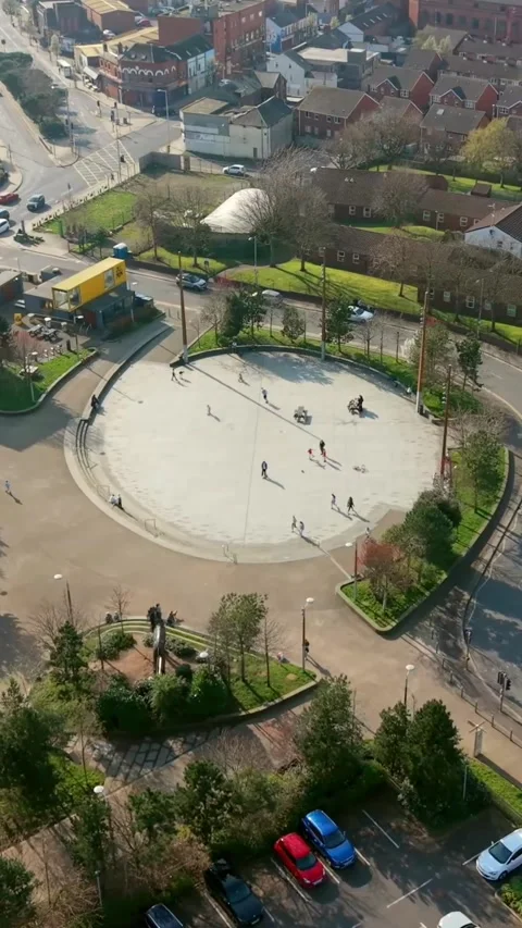 Tight clockwise 60FPS vertical social ratio aerial video of C.S. Lewis Square Stock Footage 332890746