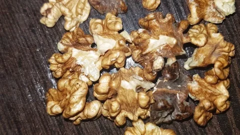 A tight close-up of the walnut kernel, revealing the tasty, nutrient-rich meat Stock Footage 322942016