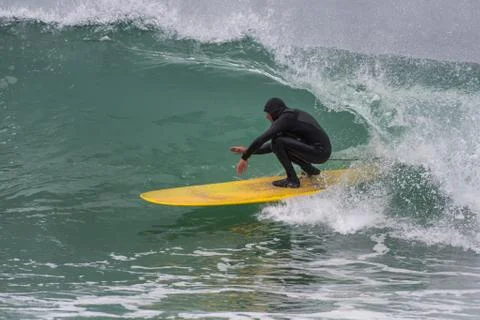 Tight fit inside the barrel of wave. Stock Photos