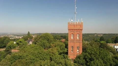 Tight fly around old brick tower in neighbourhood Stock-Footage 160998704