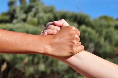 Tight hand shake Stock Photos