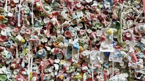 Tight macro of bubblegum lumps and drips on Seattle Post Alley Gum Wall Stock Footage 336278970