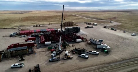A tight orbit of fracking operations on the plains of Eastern Colorado Stock Footage 167396489
