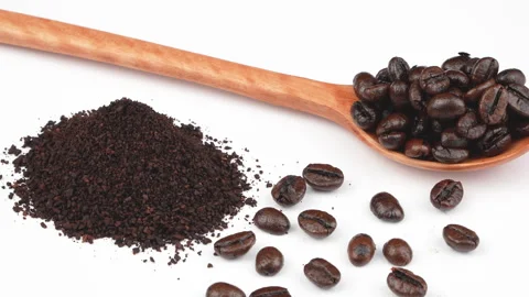 Tight Rotating Macro Roasted Coffee Beans And Ground Spoon White Video stock 331934758