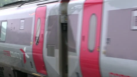 Tight Shot of an Arriving Express Train Passing Very Close to the Camera Vidéo 252903359