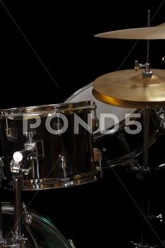Tight shot of drum kit black background Stock Photos