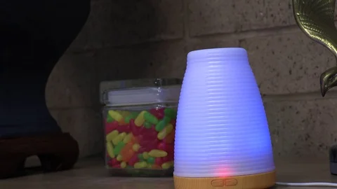 Tight Shot of an Essential Oil Diffuser on an Office Desk. Stock Footage 129690049