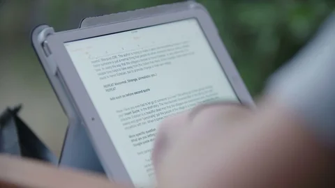 Tight Shot Of Hands Reading On An Tablet Computer Shallow Depth Of Field Stock Footage 70380643