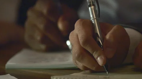 Tight Shot Hands taking Notes at Business Meeting Stock Footage 50981217