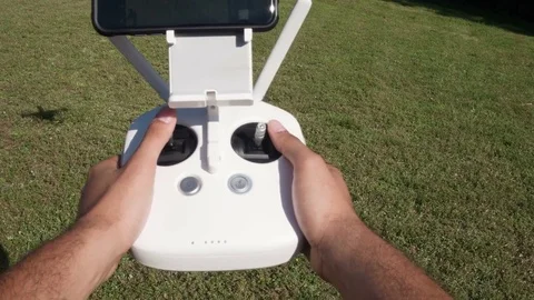 Tight Shot Of A Man Controlling A Drone With A Woman Co-Worker. Stock Footage 80294367