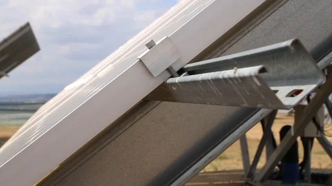 Tight shot of solar panel moving into new position Stock Footage 123981194