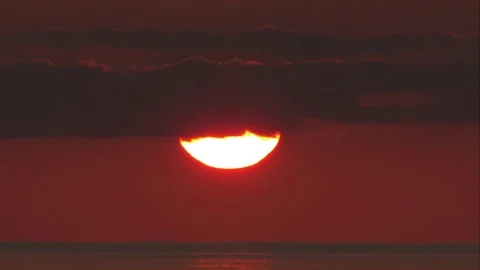 Tight shot of Sun appearing from behind a Cloud Stock Footage 82879018