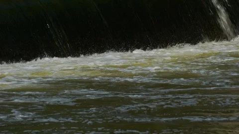 Tight shot of waterfall quickly flowing in Cuyahoga River Stock Footage 87578440