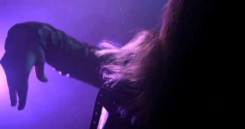 Tight shot of a womans hand while she is dancing in a rave Stock Footage 97471517