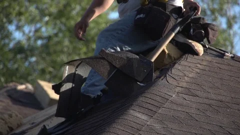 Tight Shot of Worker Hands Removing Shingles on a Roof with a Spade 動画素材 85329960