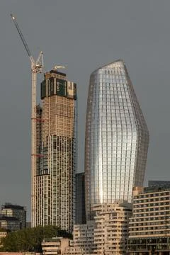 This tight, upward-reaching frame captures a city caught in the act of tran.. Stock Photos