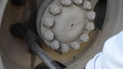 Tighten the nuts on the wheel to prevent and test outdoors in natural light Stock Footage 108891400